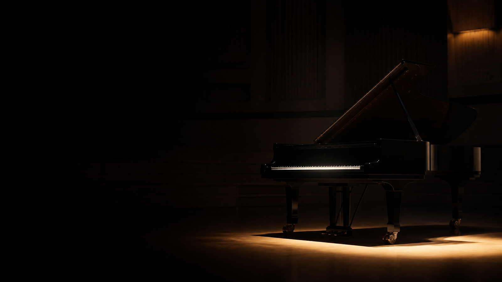 Near-black concert grand piano revealed by warm light